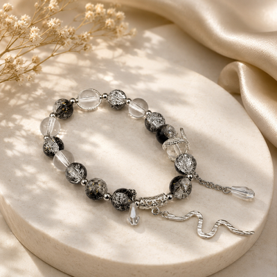 Black and clear beaded snake charm bracelet for women in Qatar