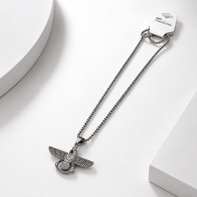 A silver-toned stainless steel eagle pendant for men necklace featuring a winged insect or beetle design.