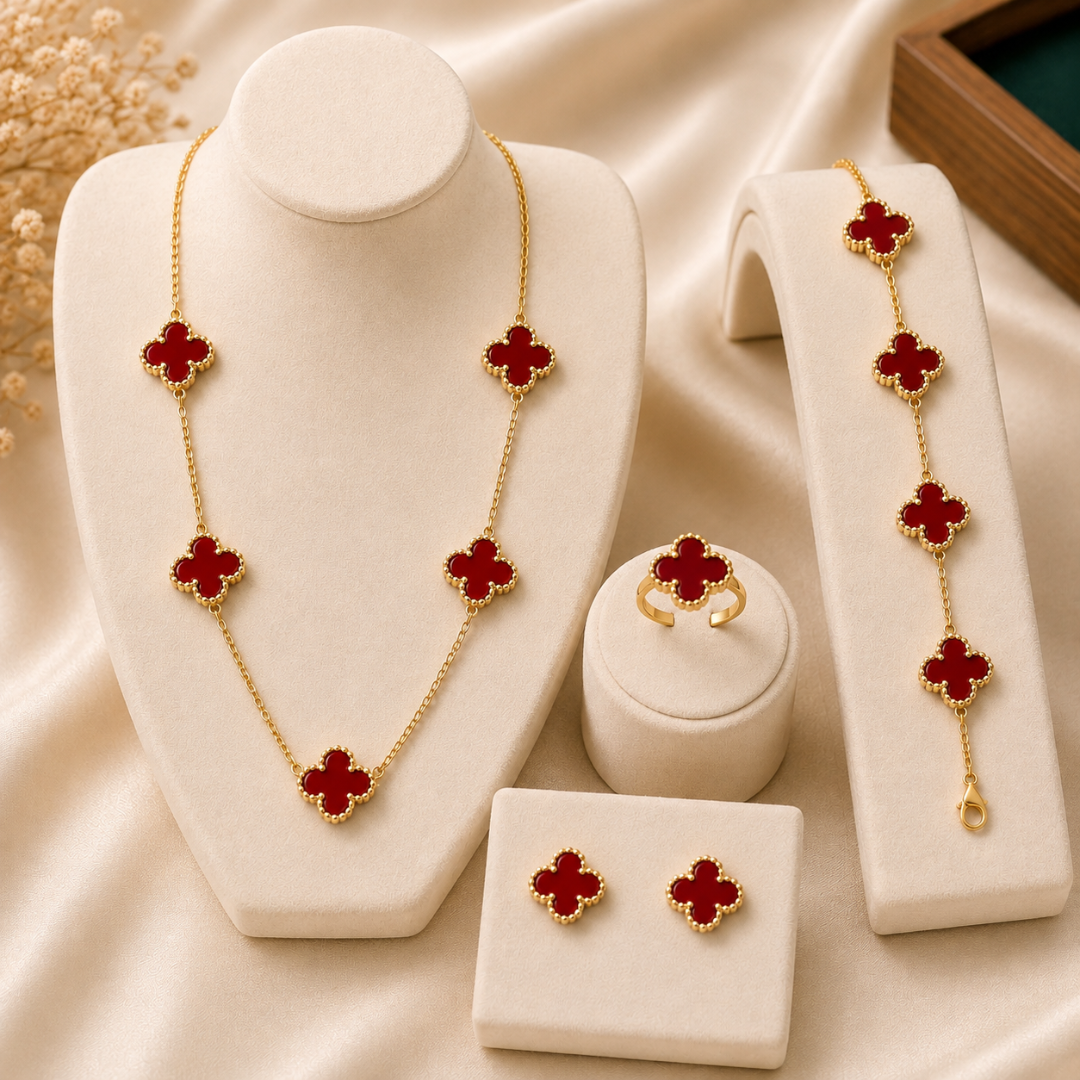 Shop our elegant red clover 4-piece jewelry set made from premium stainless steel. Includes necklace, bracelet, earrings and ring with a beautiful gold-tone finish.