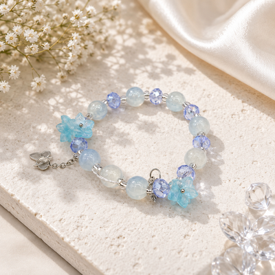 Shop a beautiful blue beaded bracelet for women in Qatar, featuring crystal-style beads, floral charms and elegant silver-tone details. Perfect for everyday wear or gifting.