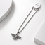 A silver-toned stainless steel  eagle pendant for men necklace featuring a winged insect or beetle design.