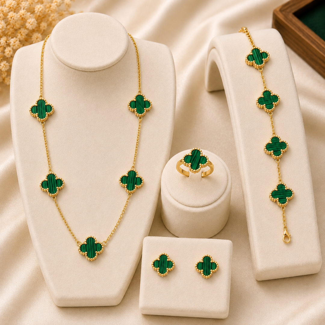 Shop an elegant green clover jewelry set featuring a matching necklace, bracelet, earrings and ring with beautiful gold-tone detailing. Perfect for women and gifting.