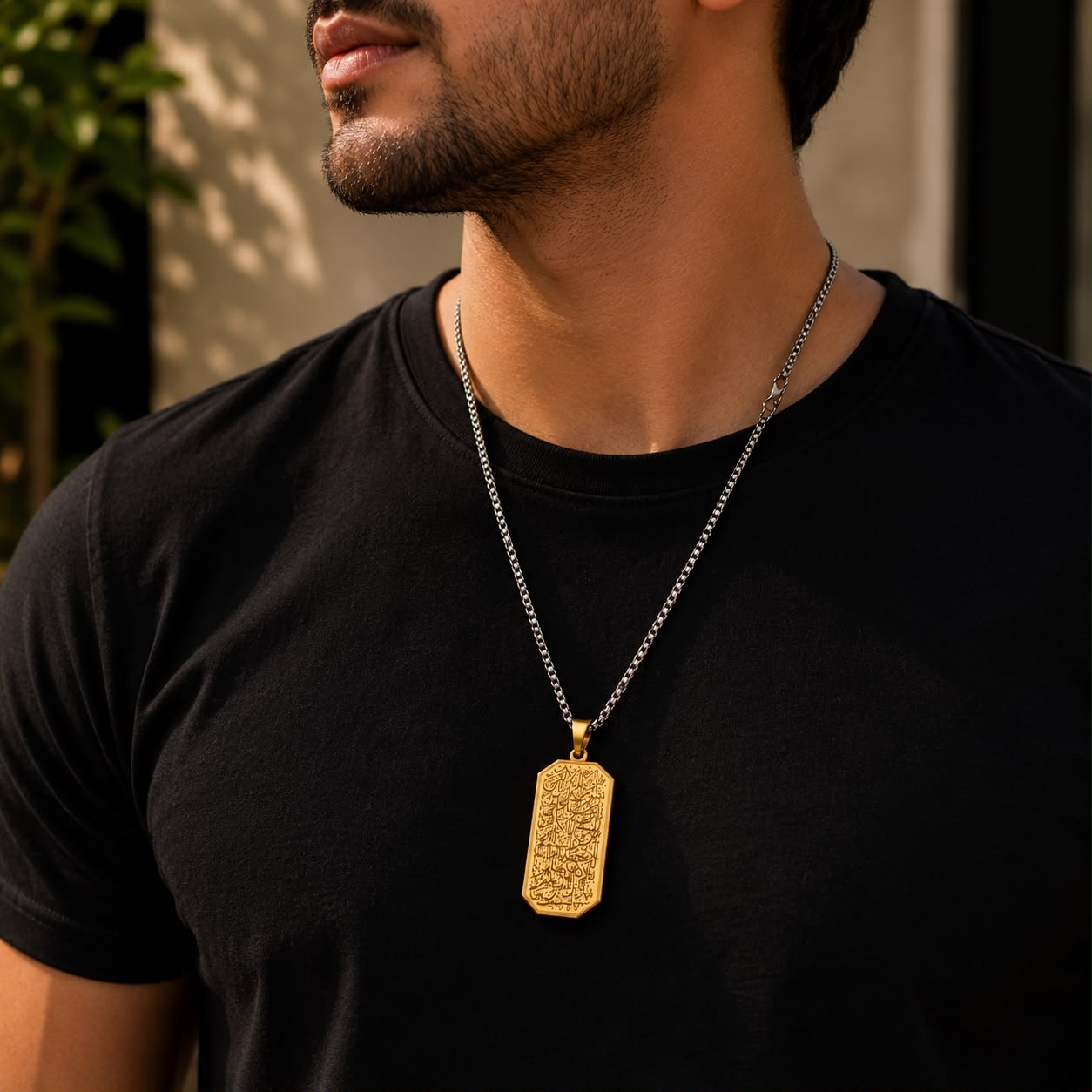 Shop men's Arabic calligraphy pendant necklaces in Qatar. Premium 316L stainless steel with an elegant gold-tone pendant and silver chain.