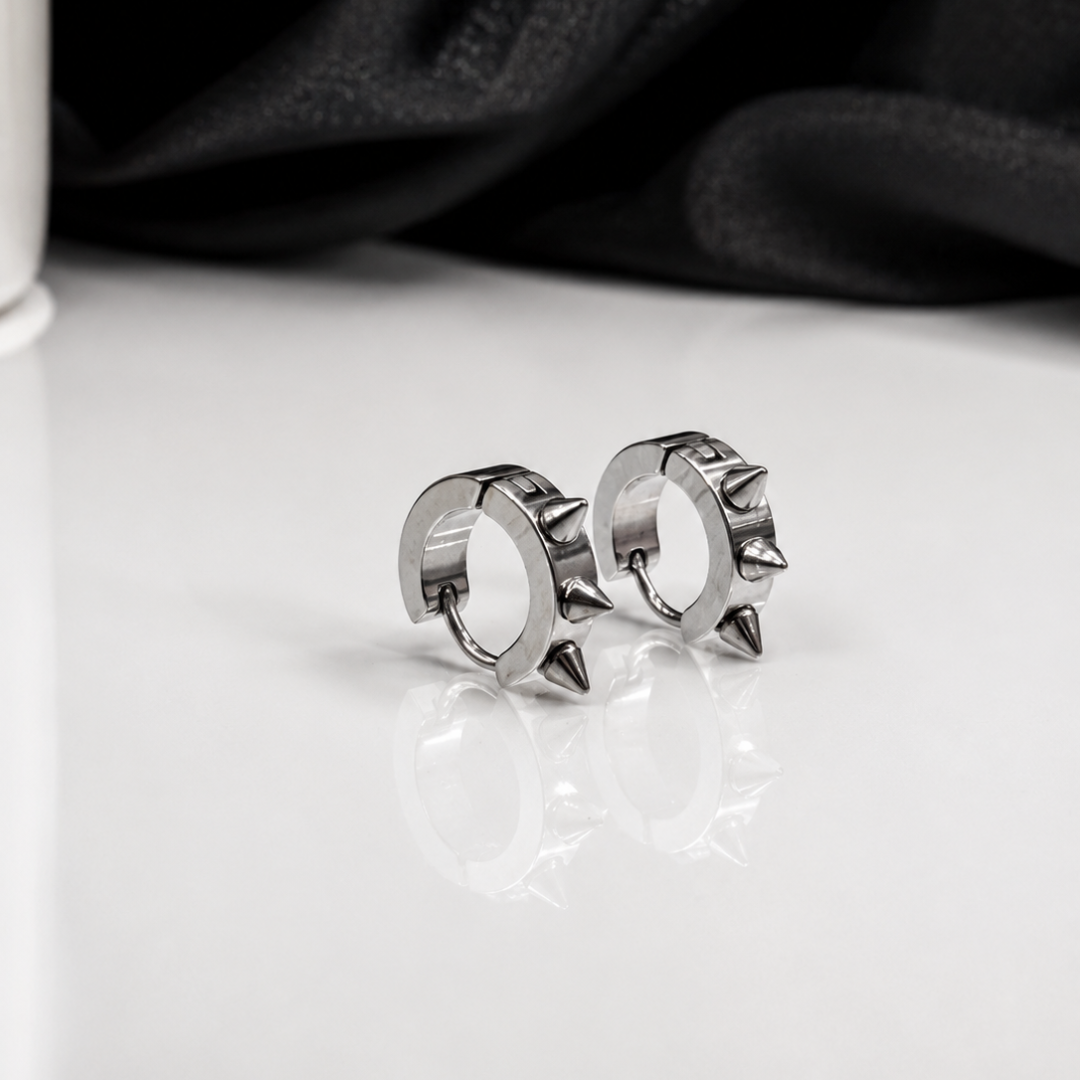 Shop men's spiked hoop earrings made from stainless steel. Edgy silver punk design with cone spikes, perfect for streetwear, parties and everyday style.