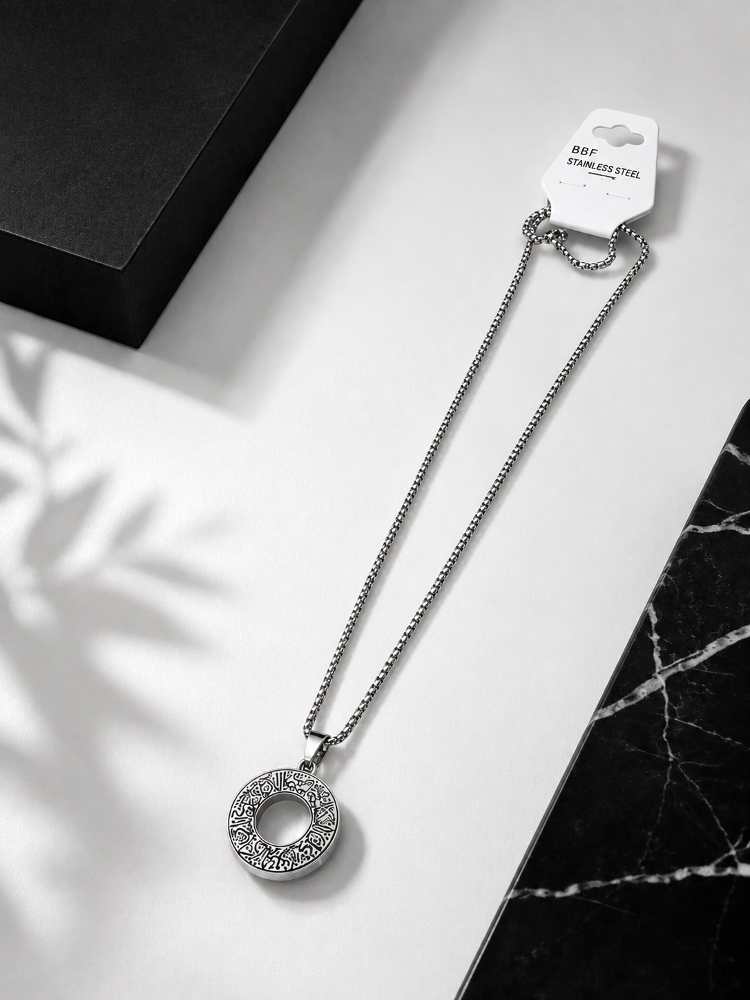 A silver-toned stainless steel FOR MEN necklace with a circular ayat al kursi pendant